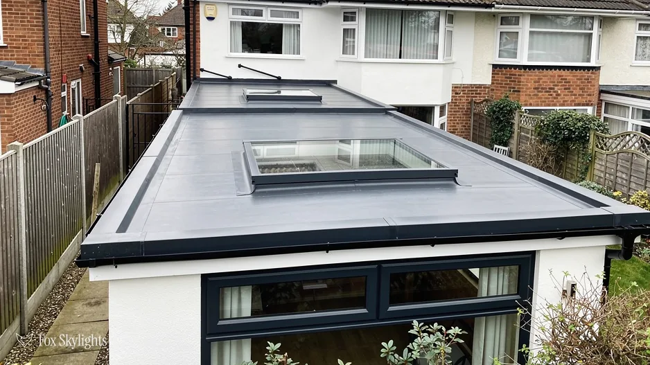 Flat rooflight on a single storey rear extension behind a semi detached house