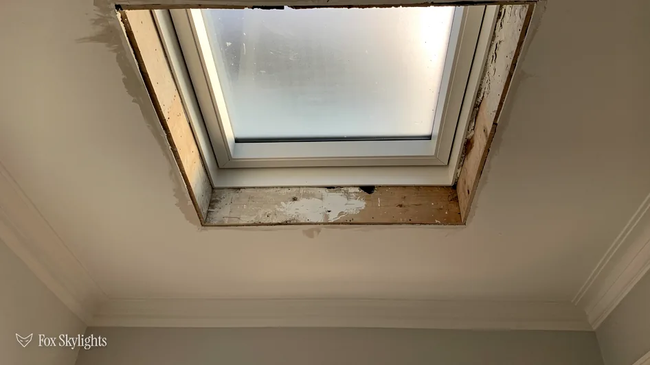 Rooflight set in a new ceiling opening with the lining still to finish
