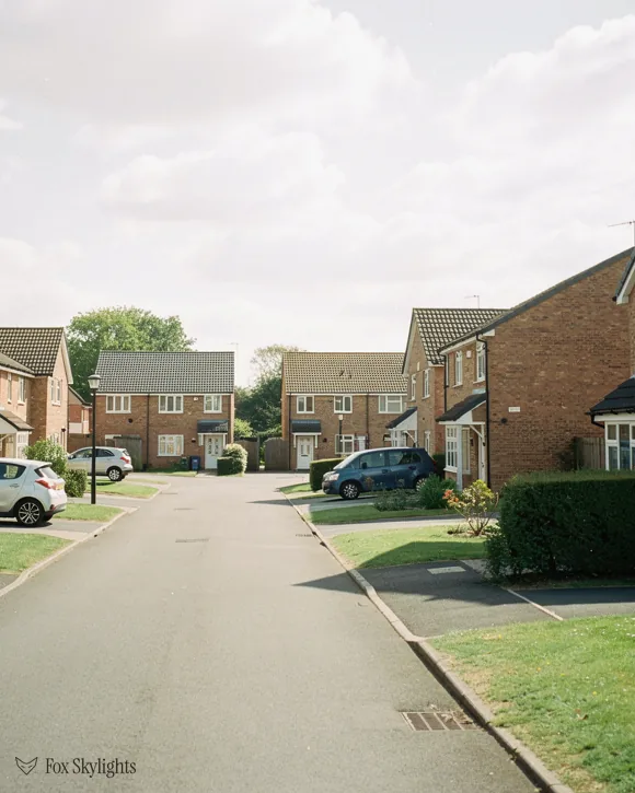 Quiet cul de sac of modern brick houses with front lawns
